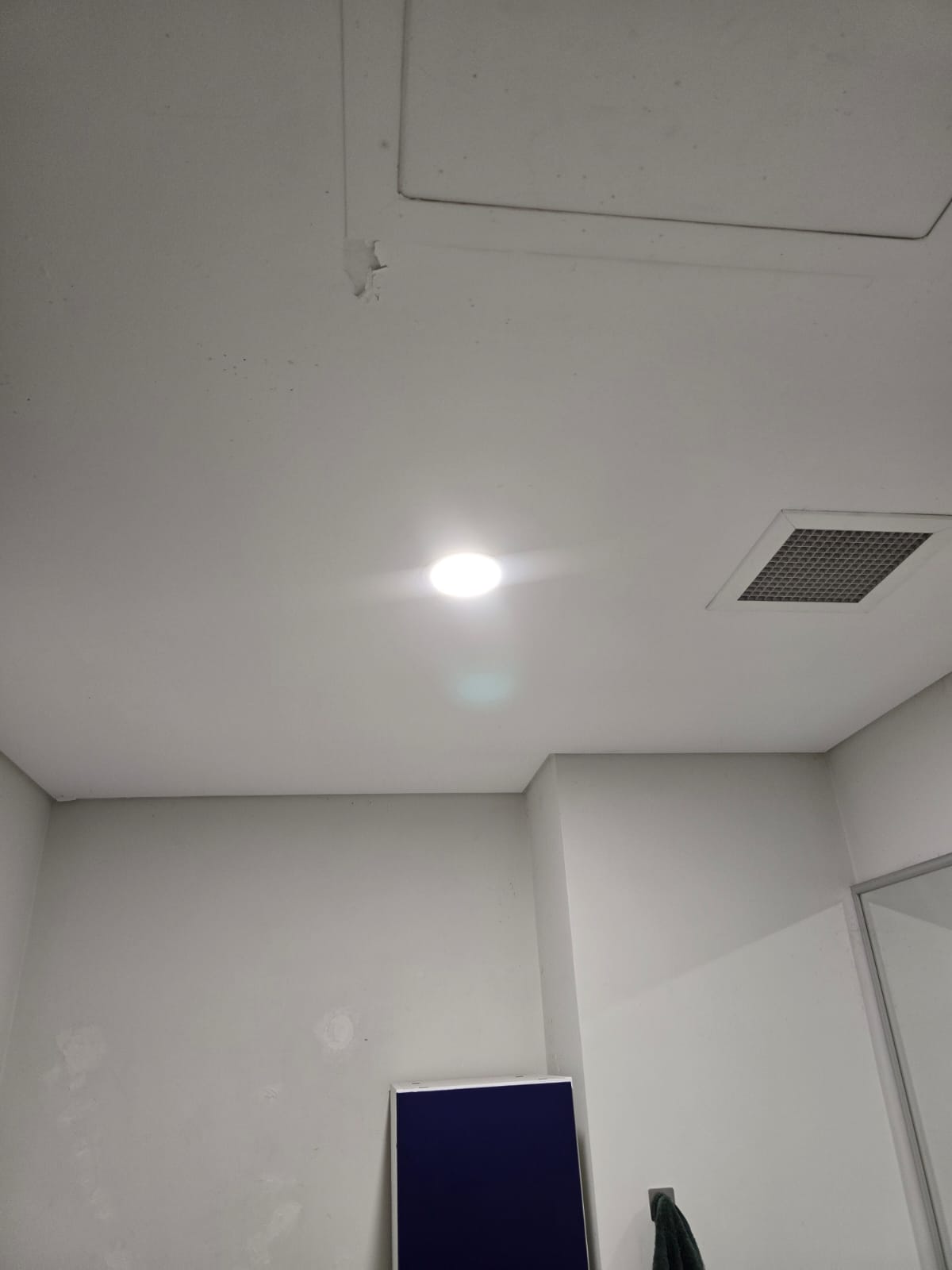 LED downlight installation in AirBnB bathroom in West Perth with innovative plug base for easy maintenance