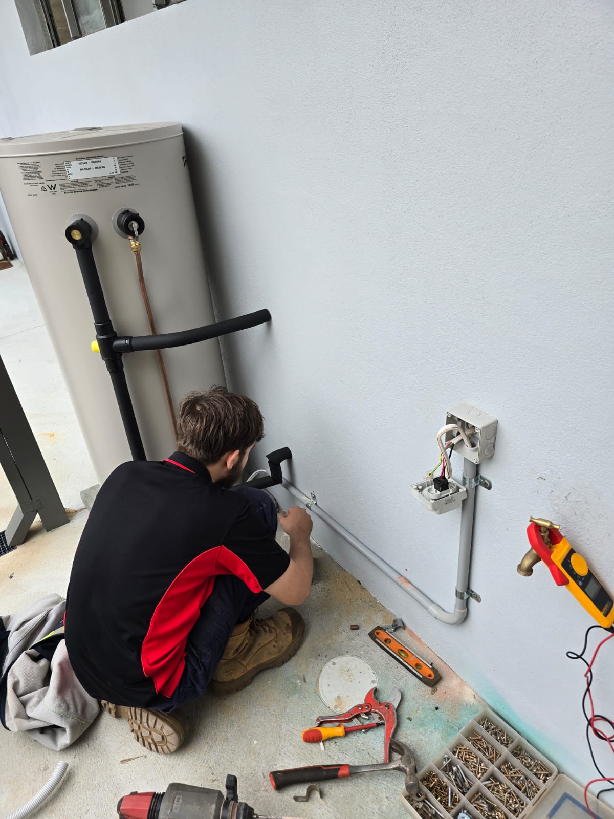Commercial hot water system electrical circuit installation with professional wiring and safety switches