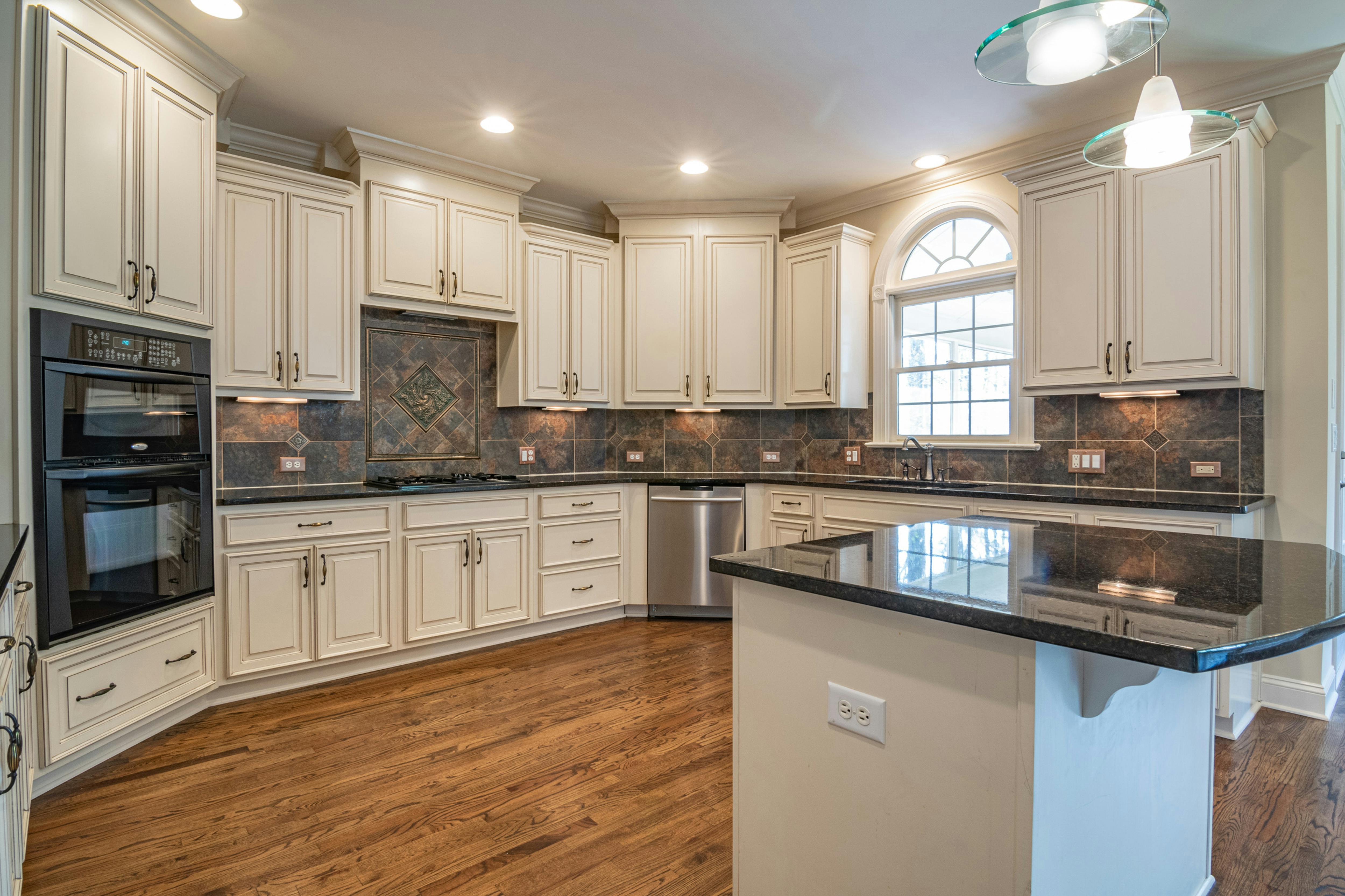 Modern kitchen electrical upgrade featuring LED downlight installation and new power point outlets in Perth home