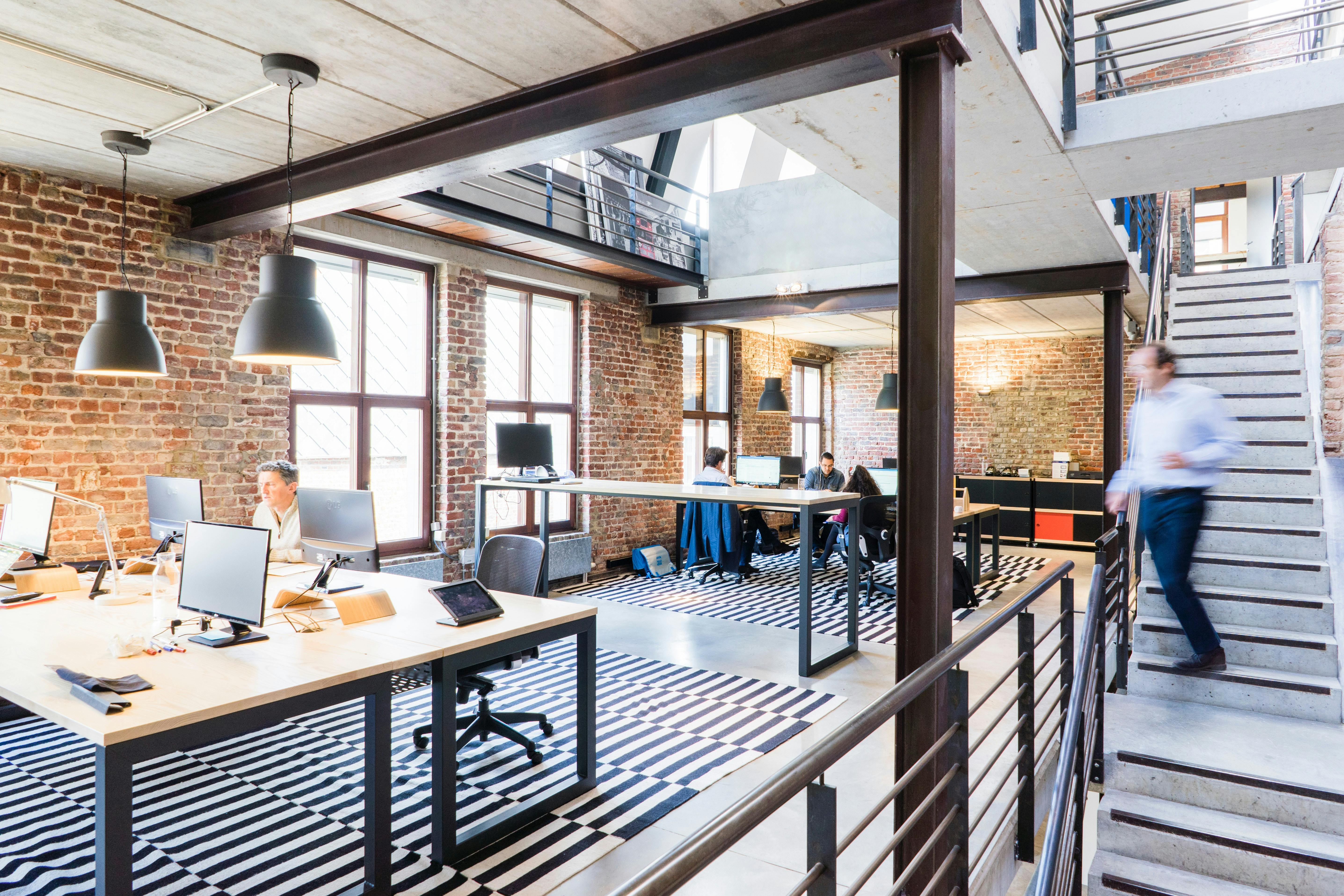 Modern office pendant lighting installation with contemporary ambient lighting for Perth commercial workspace